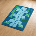 Upina Spielteppich Hopse-Spiel blau im Kinderzimmer – schräge Perspektive